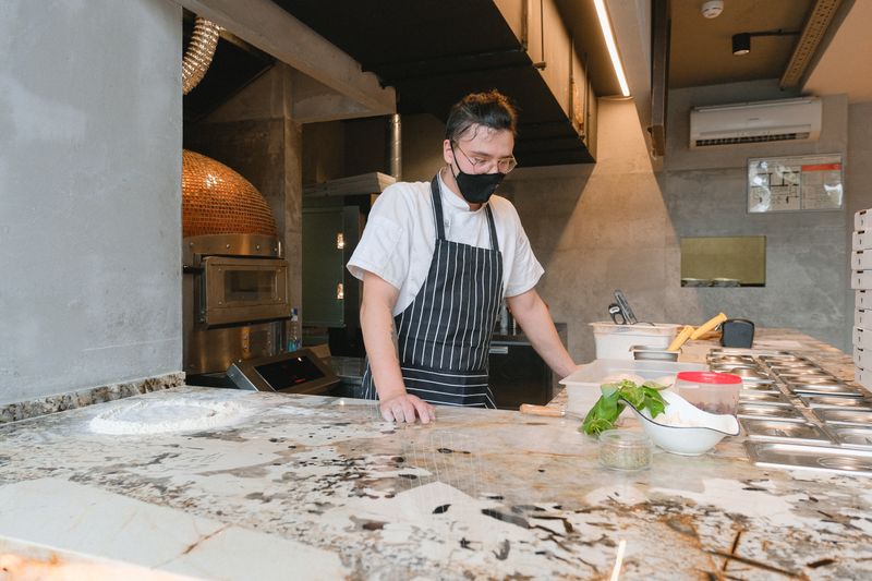 Mod Pizza kitchen with fresh ingredients being prepared